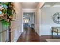 Inviting foyer boasting hardwood floors, wainscoting, and an open view into the living spaces at 407 After Glow Smt, Canton, GA 30114