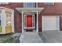 Inviting front entrance with a bright red door and well-maintained landscaping at 4270 Fallbrook Dr, Duluth, GA 30096