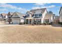 Inviting two-story home with a manicured lawn, showcasing an attached garage and appealing facade at 2207 Derbyshire Sw Dr, Marietta, GA 30064