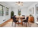 Bright dining room with hardwood floors, natural light, and seating for four at 2122 Kimberly Sw Rd, Atlanta, GA 30331