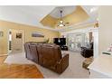 Bright living room with comfortable seating, stone fireplace, and sliding glass doors leading to the outdoors at 3710 Glen Ian Dr, Loganville, GA 30052