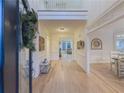 Bright foyer featuring hardwood floors, high ceilings, and elegant decor with views into other living spaces at 1320 Kildare Ct, Snellville, GA 30078