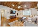 Cozy living room featuring hardwood floors, wooden ceiling, and ample natural light at 2350 Brenda Se Dr, Smyrna, GA 30080