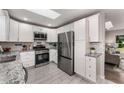 Modern kitchen with white cabinets, subway tile backsplash, and stainless steel appliances at 2831 Spruce Point Rd, South Fulton, GA 30349