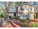 Charming two-story home with well-maintained landscaping and a welcoming front entrance at 1037 Martin Rd, Stone Mountain, GA 30088