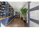Inviting entryway with hardwood floors, built-in bookshelves, and a view into the dining area at 2020 Bixby Se St, Atlanta, GA 30317