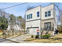 Modern two-story home featuring a stylish facade, two-car garage, and well-manicured lawn at 2020 Bixby Se St, Atlanta, GA 30317