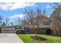 Beautiful home with well-manicured lawn, complemented by mature trees creating a picturesque setting at 260 Mansell Cir, Roswell, GA 30075