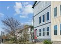 Modern two-tone gray house with a red front door and a small yard with easy street access at 560 John Wesley Dobbs Ave, Atlanta, GA 30312