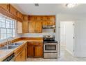 Functional kitchen with stainless steel appliances and classic wooden cabinetry at 3435 Macland Rd, Powder Springs, GA 30127
