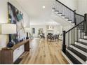 Spacious foyer with staircase leading to the upper level, and hardwood flooring at 510 Forest St, Buford, GA 30518