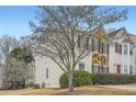 Inviting townhome showcases a stone accent wall and red shutters at 2510 Thorngate Dr, Acworth, GA 30101