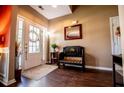 Warm foyer with hardwood floors, bench seating, and natural light streaming through the front door at 613 Hemlock Ct, Villa Rica, GA 30180