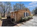 Well-maintained brick home with updated landscaping and charming architectural details at 3080 Forrest Park Road Se, Atlanta, GA 30354