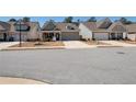 A charming home with a brick facade and a two-car garage situated in a Gathering-friendly neighborhood at 2628 Songbird Ln, Grayson, GA 30017