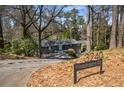 View of house from street with sign: 3240 Pinestream Rd at 3240 Pinestream Nw Rd, Atlanta, GA 30327