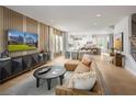 Open-concept living area seamlessly connecting the living room, dining area, and modern kitchen at 2453 Red Maple Se Xing # 118, Smyrna, GA 30080