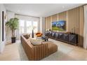 Cozy living room featuring stylish furniture, a wall-mounted TV, and large windows for natural light at 2453 Red Maple Se Xing # 118, Smyrna, GA 30080
