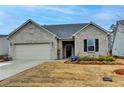 Charming single-story home with a well-manicured lawn and a two-car garage, offering comfortable suburban living at 811 Pineberry Ct, Grayson, GA 30017