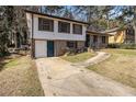 Charming two-story home featuring a brick facade and driveway at 989 Queen Elizabeth Way, Morrow, GA 30260