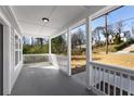 Covered porch with white railings offering neighborhood views and a relaxed outdoor space at 2150 Essex Sw Ave, Atlanta, GA 30311