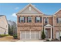 Charming two-story brick home featuring a two-car garage and a welcoming front porch at 1315 Golden Rock Se Ln # 2, Marietta, GA 30067