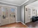 Entryway with wood floors, and French doors providing natural light and scenic views at 526 Lakeside Dr, Hiram, GA 30141