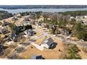This aerial shot showcases the property's proximity to the lake and highlights the surrounding neighborhood at 6801 Louis Dr, Locust Grove, GA 30248