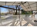 A spacious covered patio with white railing and ceiling fans for outdoor enjoyment at 441 Windsor Dr, Forest Park, GA 30297
