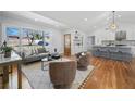 Bright living room features hardwood floors, modern furniture, and large windows showcasing the neighborhood at 2117 Brannen Se Rd, Atlanta, GA 30316
