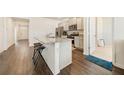 Bright kitchen with an island, granite countertops and stainless steel appliances at 2030 Vidalia Court, Dacula, GA 30019