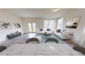 Bright living room with hardwood floors, stylish furniture, and French doors leading to a private patio at 2520 Coventry Street, Atlanta, GA 30331