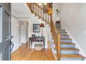 Inviting foyer featuring hardwood floors, a staircase with wood banister, and neutral wall colors, creating a welcoming entrance at 3167 Northbrook Dr, Atlanta, GA 30341