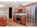 Well-equipped kitchen with stainless steel appliances and plenty of counter space at 4273 Creekrun Cir, Buford, GA 30519
