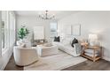 Bright living room featuring a modern design with hardwood floors and stylish decor at 3810 Cottage Cir, Clarkston, GA 30021