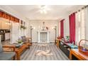 Inviting living room with hardwood floors, stylish decor, and a cozy fireplace at 999 Chestnut Oak Ct, Lawrenceville, GA 30046