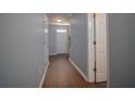 Inviting hallway with wood floors, fresh paint and a bright white front door at 5381 Briar Creek Ln, Norcross, GA 30071