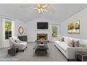 Bright living room with fireplace, vaulted ceilings, and neutral decor at 305 Bridgewater Ter, Canton, GA 30115