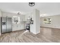 Open kitchen with stainless steel appliances, granite countertops, and modern lighting at 2401 Westland Way, Acworth, GA 30102