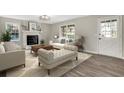 Bright living room with fireplace, modern lighting and lots of natural light at 2401 Westland Way, Acworth, GA 30102