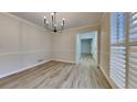 Sunlit dining room with modern light fixture and beautiful flooring at 260 N Fayette Dr, Fayetteville, GA 30214