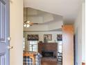 Cozy living room features a brick fireplace, tray ceiling, and comfortable seating at 3533 Saddlebrook Dr, Loganville, GA 30052