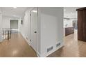Bright hallway with hardwood floors and a view of the kitchen and outdoor space at 2153 Starfire Drive Ne Dr, Atlanta, GA 30345