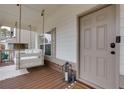 Inviting front porch with a porch swing, perfect for unwinding and enjoying the neighborhood at 305 Parc Xing, Acworth, GA 30102
