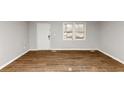 Bright living room with new hardwood floors, freshly painted walls, and abundant natural light at 4275 Ridgetop Dr, Ellenwood, GA 30294