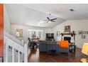 Bright living room with vaulted ceiling, hardwood floors, fireplace, and large bay window at 6038 Maryjo Ln, Norcross, GA 30093