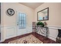 Bright foyer featuring hardwood floors, fresh paint, classic trim, and decorative accents at 316 Silverwood Dr, Dallas, GA 30157