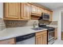Updated kitchen with stainless steel appliances and sleek countertops at 408 River Run Dr, Atlanta, GA 30350