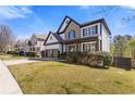 Attractive home featuring a well-maintained lawn and a two-car garage, complemented by neat landscaping at 7382 Gossamer St, Union City, GA 30291