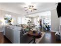 Comfortable living room featuring an open floor plan and views of the kitchen and dining areas at 7738 Fawn Cir, Covington, GA 30014